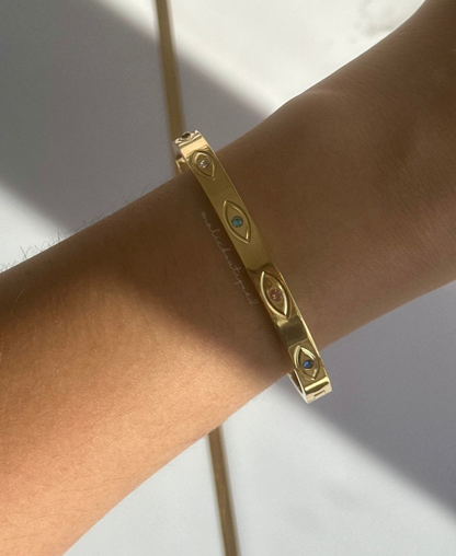 Bangle oro con ojos y zirconias en colores Stainless Steel