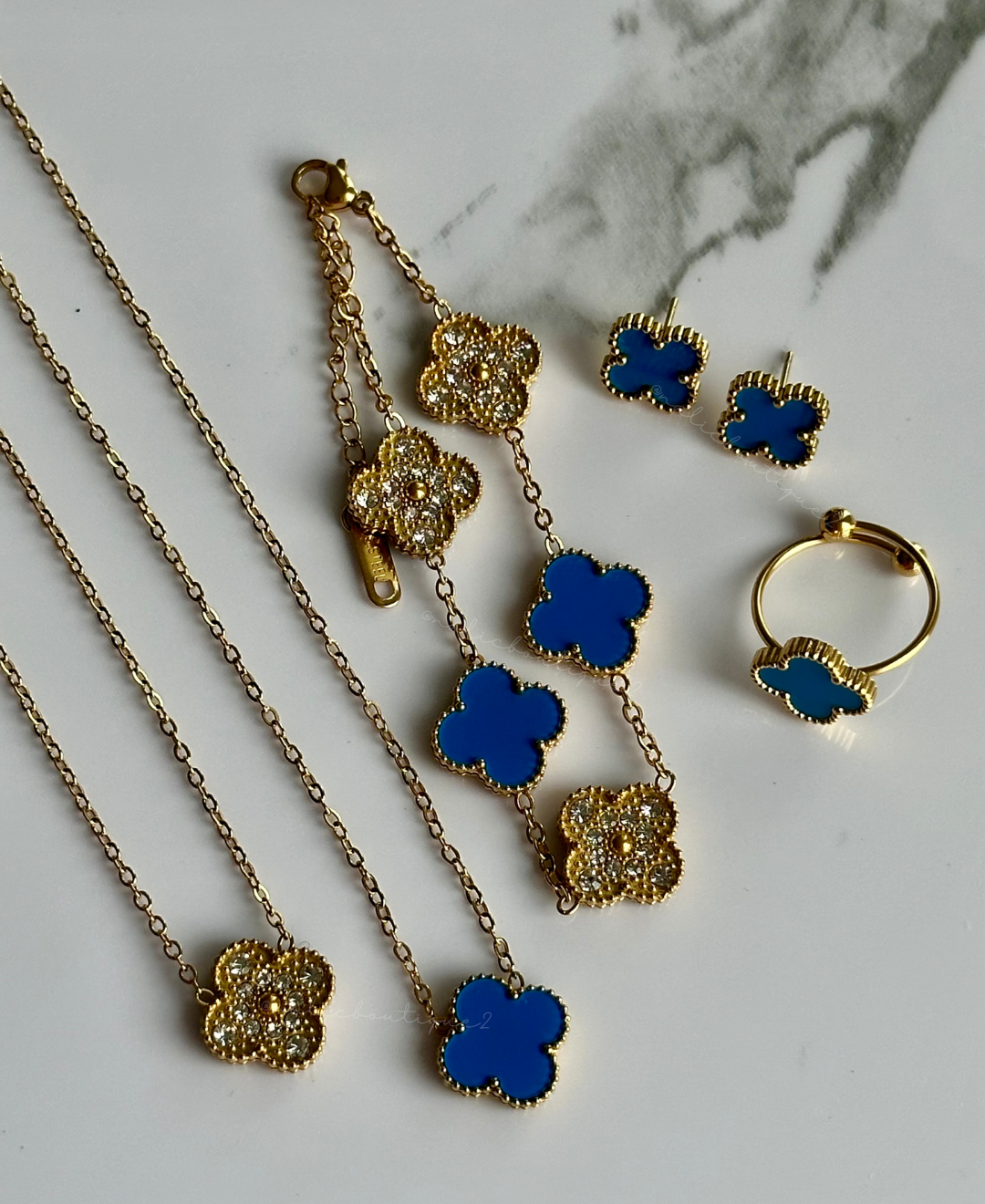 Set trébol azul y oro reversible en SS - 4 piezas