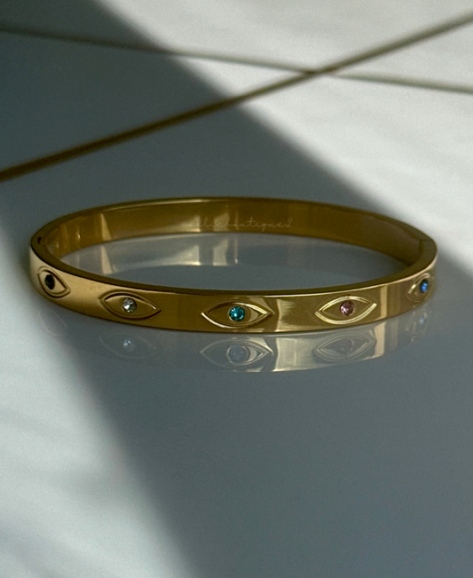 Bangle oro con ojos y zirconias en colores Stainless Steel